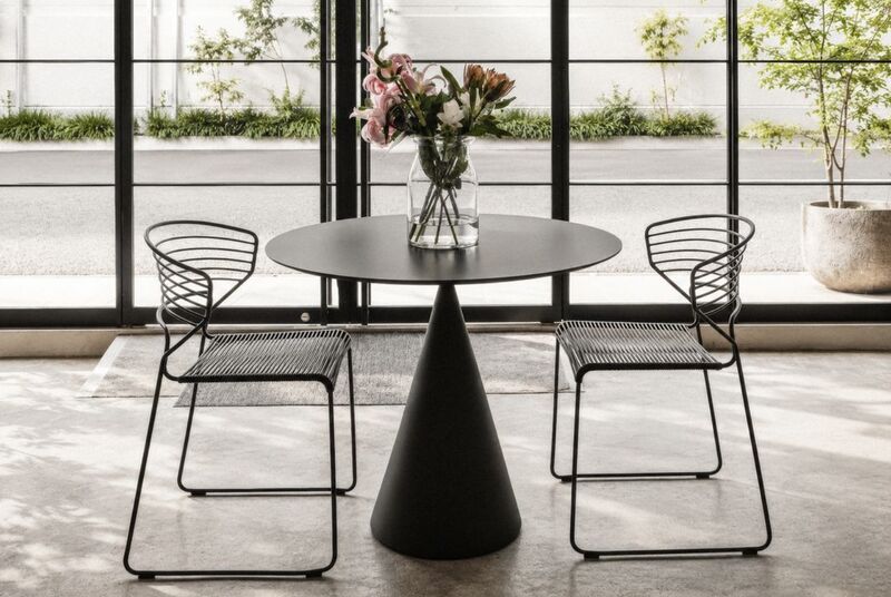 LIFE IN MOTION cafe table and wire chairs at LIGHT BOX GALLERY